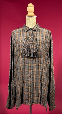 plaid shirt on a mannequin stand with a red background