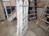 a ladder that is leaning against a wall in a room
