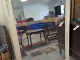 a large mirror sitting on the floor in a room