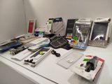 a lot of electronic items on a table in a room