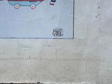a drawing on the wall of a building with a boat on it