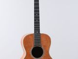 an image of a guitar hanging from a string on a white background
