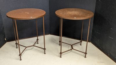 pair of round side tables with metal legs and a wooden top
