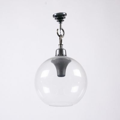 a close up of a clear glass light hanging from a ceiling