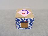 a blue and white box with a cupcake inside of it