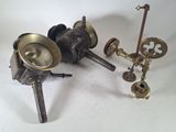 two different types of brass objects on a white surface