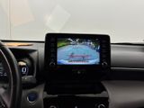 a car dashboard with a monitor and a steering wheel