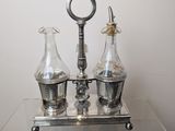 a glass table with three bottles and a key on it