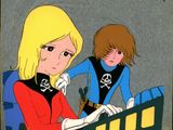 two cartoon characters are sitting at a desk with a computer