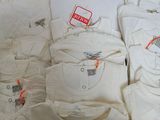 a lot of t - shirts on display in a store