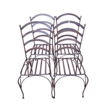 pair of vintage wrought iron patio chairs