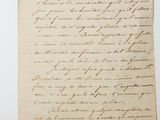 a letter written in cursive handwriting on a piece of paper
