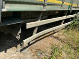 a train that is sitting on the tracks in the grass