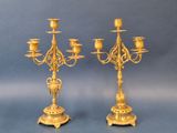 pair of antique brass candelabs on stands