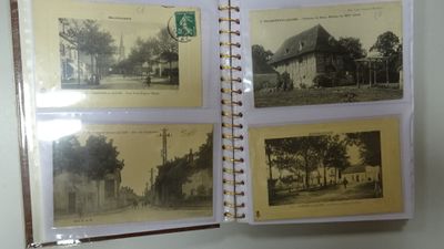 an old photo album with a lot of old photos on it