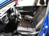the interior of a blue car with black seats and a steering wheel