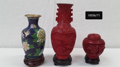 three vases sitting next to each other on a table
