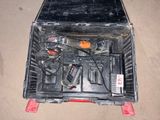 a tool box with tools in it sitting on the floor
