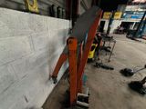 a large piece of wood leaning against a wall in a garage