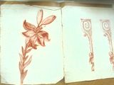 un dessin représentant une fleur et des ciseaux posés sur un livre