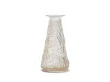 a white vase sitting on a white surface