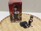 anime figurines of a woman in a black dress and a box on a wicker tray