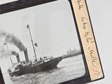a black and white photo of a boat in the water