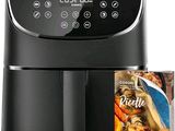 un gros plan d'une friteuse à air chaud avec un magazine posé à côté