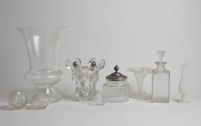 a lot of glass items that are sitting on a table