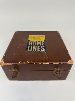 a brown suitcase with a sticker on it that says home lines