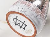 a close up of a lamp on a white surface