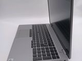 a laptop that is sitting on a white table