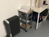 a radiator and a table in the corner of a room