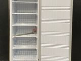 an empty refrigerator with its door open on the floor