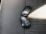 a computer mouse sitting on top of a seat in a car
