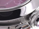 a close up of a wrist watch with a purple dial