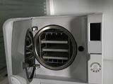 a white microwave with a fan on top of it