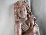 a statue of a woman holding a baby in her arms