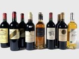several bottles of wine are lined up in a row on a white surface