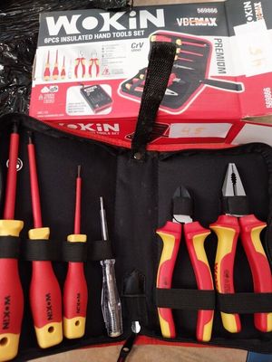 many tools in a tool bag that are on the table