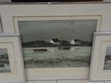 three framed pictures on the floor of a living room