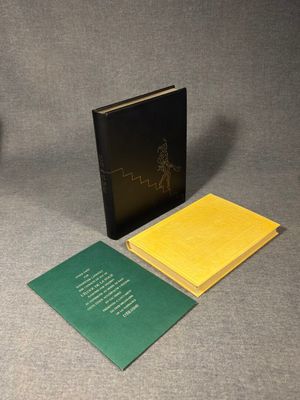 two books sitting on top of a table next to each other