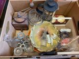 a box full of glass items that are sitting on a table