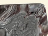 a close up of a glass plate with a horse on it