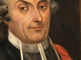 portrait of a man in a black and red coat with a white collar