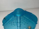 a blue plastic bird feeder on a white counter