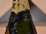 a close up of a bottle of champagne on a table