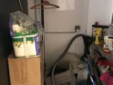 a pile of toilet paper and other items in a room