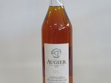 a bottle of alcohol sitting on top of a white table