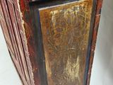 an old wooden cabinet with two drawers on it